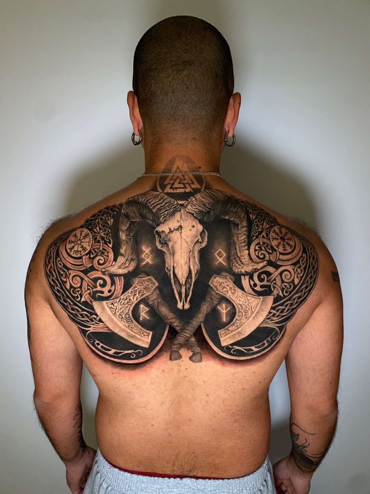 Large blackwork back piece by Caos Art Tattoo