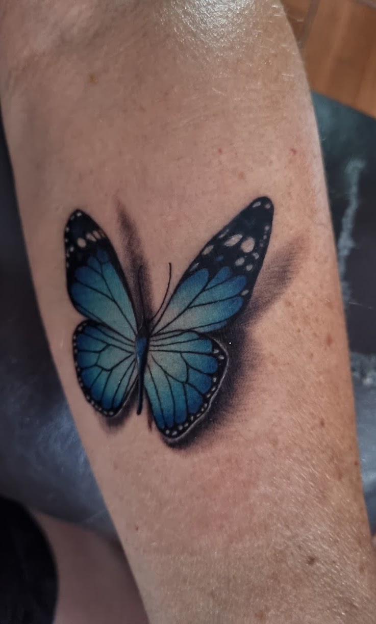 Tatuaje Mariposa azul morpho realista 3D — CAOS Art Tattoo Chile