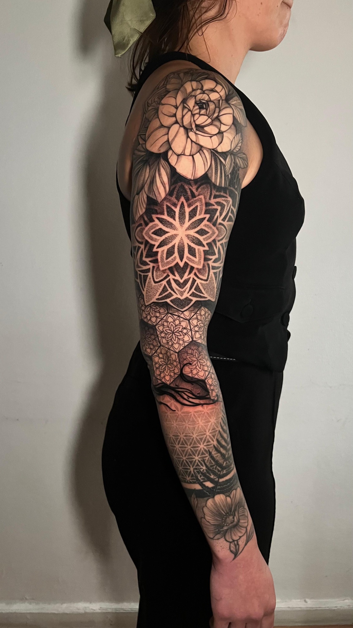 Geometric ornamental full sleeve tattoo with mandala and floral elements — Caos Art Tattoo Santiago