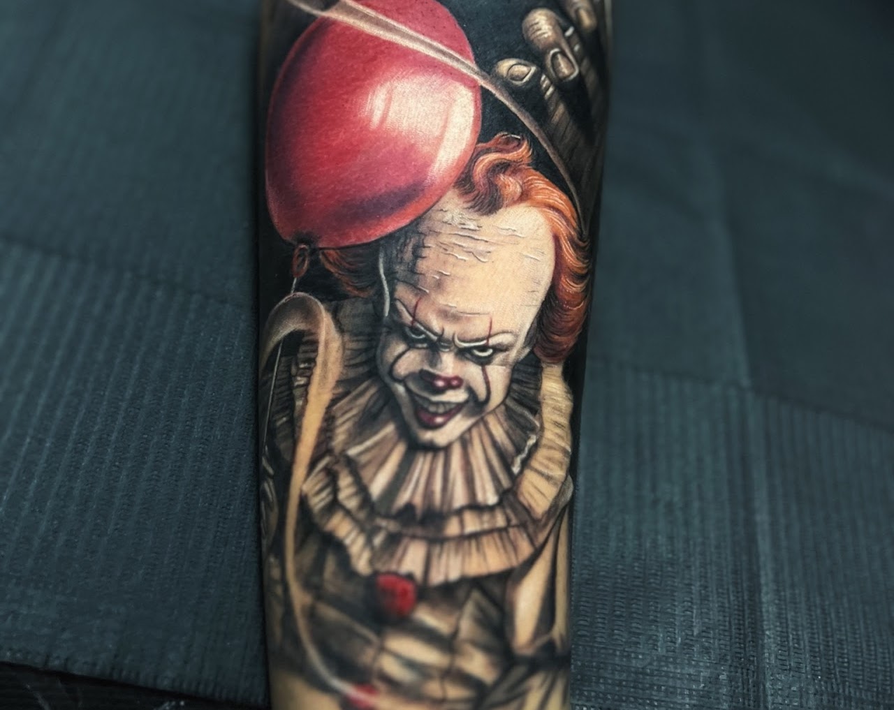 Color realism Pennywise tattoo by Caos Art Tattoo Santiago